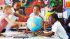 Children looking at a globe